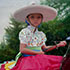 Portrait from photo sample #232 a Mexican girl on horseback at the carnival